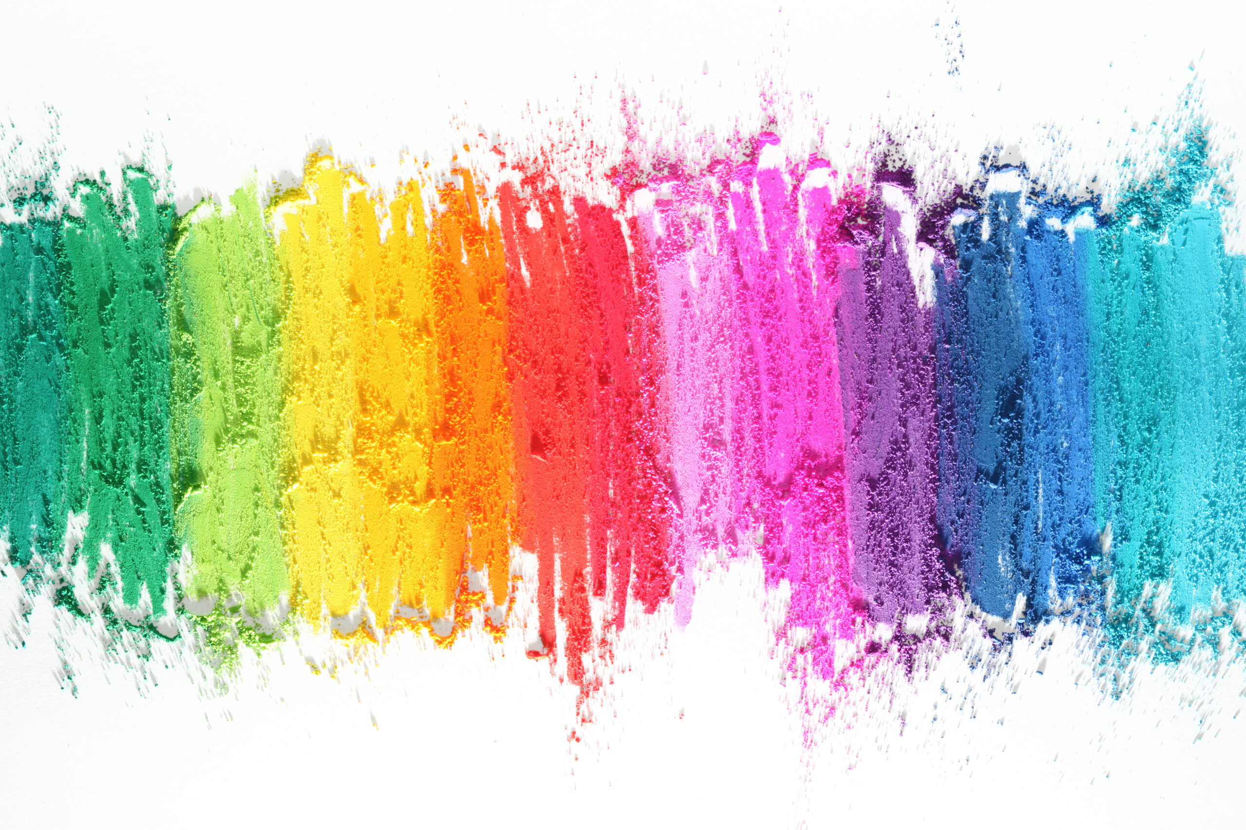 crayon colors scrubbed into a white background