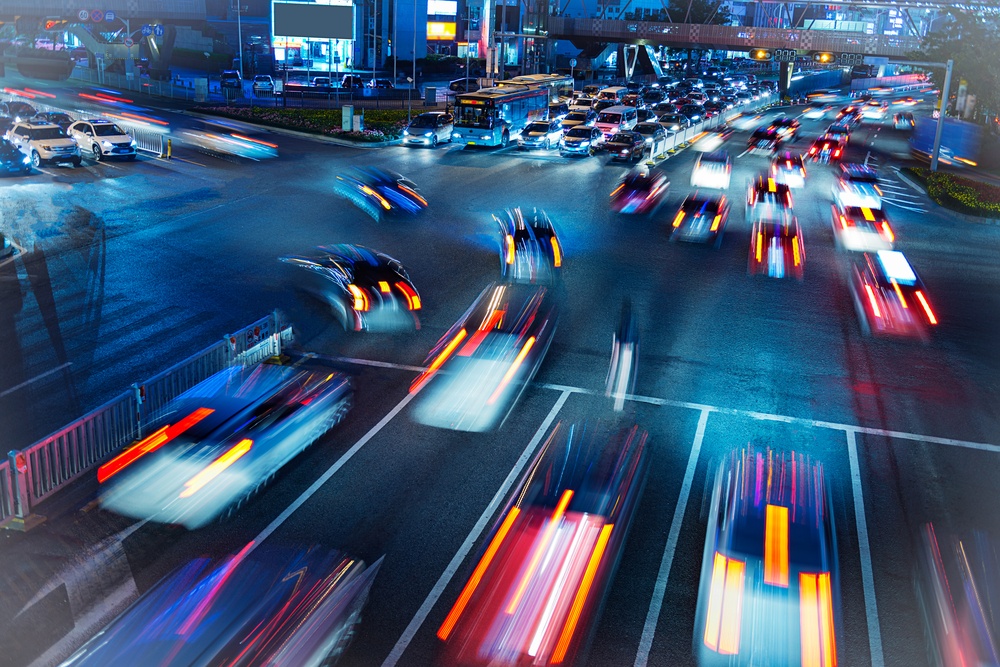 The Pace of Thankfulness is unhurried - slow down - cars headlights blurred on freeway - Shutterstock