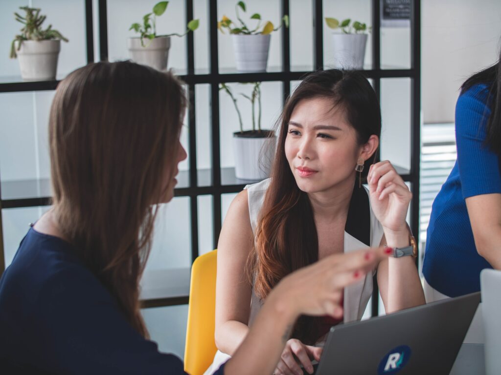 Why should I listen - listening is an act of love - a woman listens intently as her friend shares her point of view - photo by Mimi Thian - Unsplash