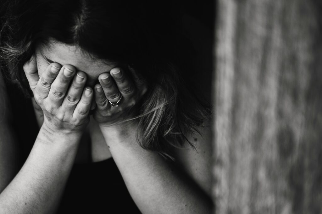 When You Can't Pray Anymore - woman with her face in her hands - photo by Kat Jayne - Pexels