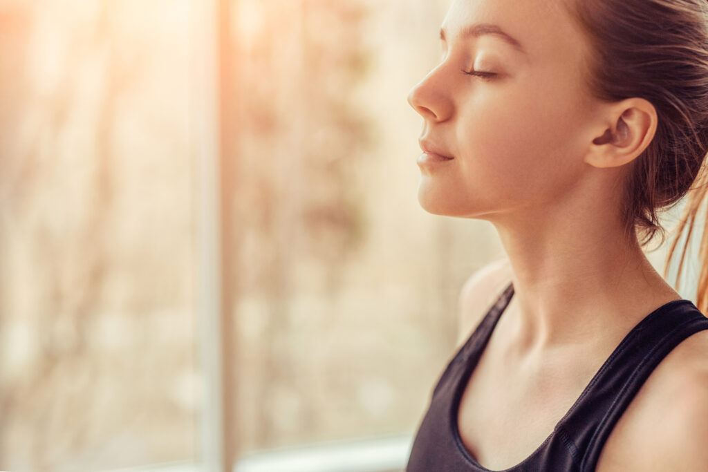woman practicing breath prayer and relaxation
