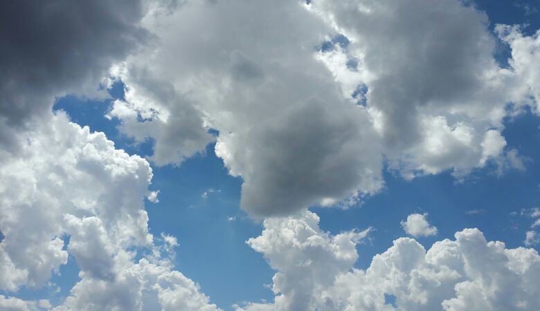 fluffy clouds across a blue sky