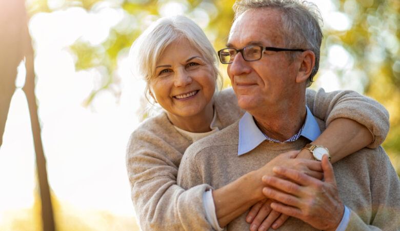 Mindfulness and Aging - a happy elderly couple embracing - Shutterstock