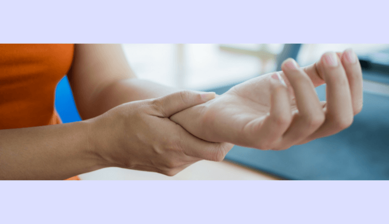 female hand massages other wrist to ease wrist pain
