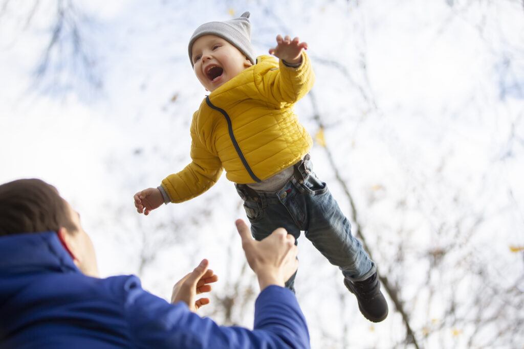 Father catching little son who is falling - picture of surrendering to Father God - you can trust Him - surrender now