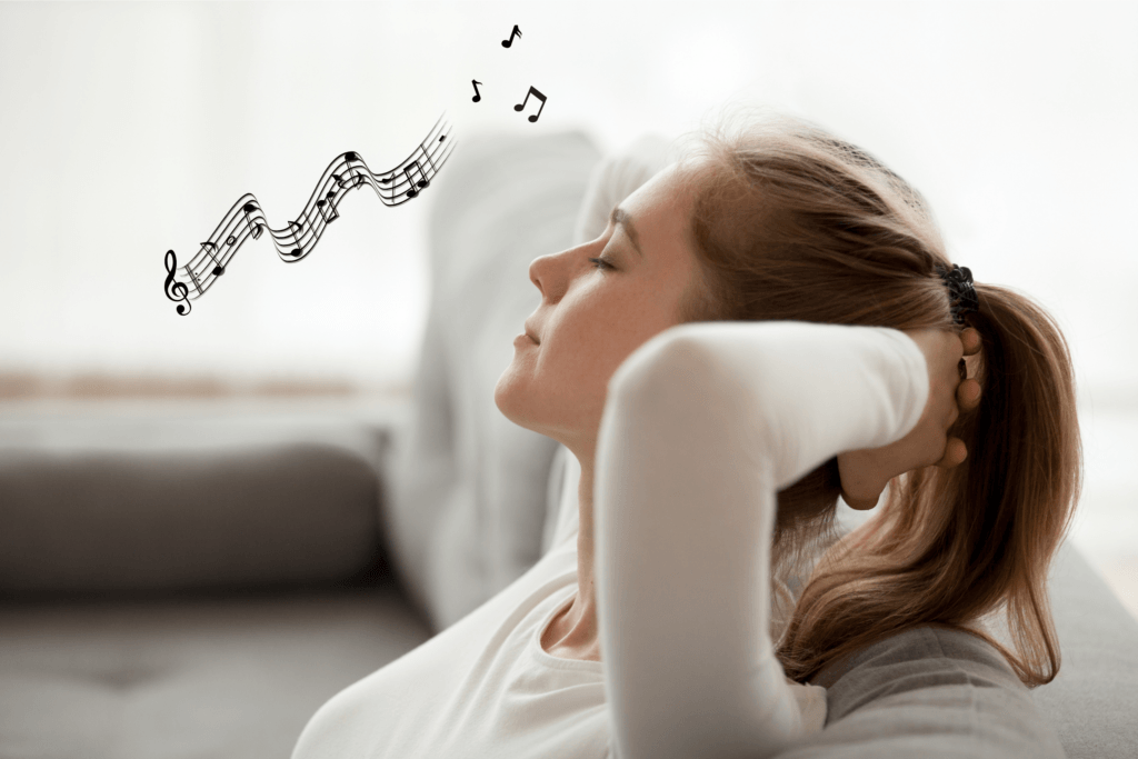 music for anxiety relief - a woman relaxes with eyes closed as bars of music waft through the air