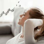 a woman relaxes with eyes closed, listening to music