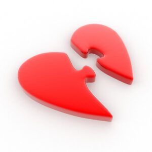 Red heart divided in half - like two puzzle pieces - God is the only One who can complete you - God is enough