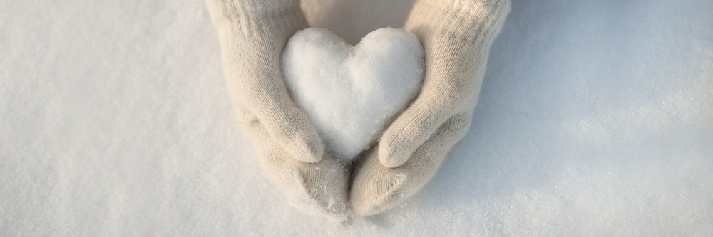 Hands in mittens hold a heart shaped ball of snow - nature is God's gift - winter - Shutterstock