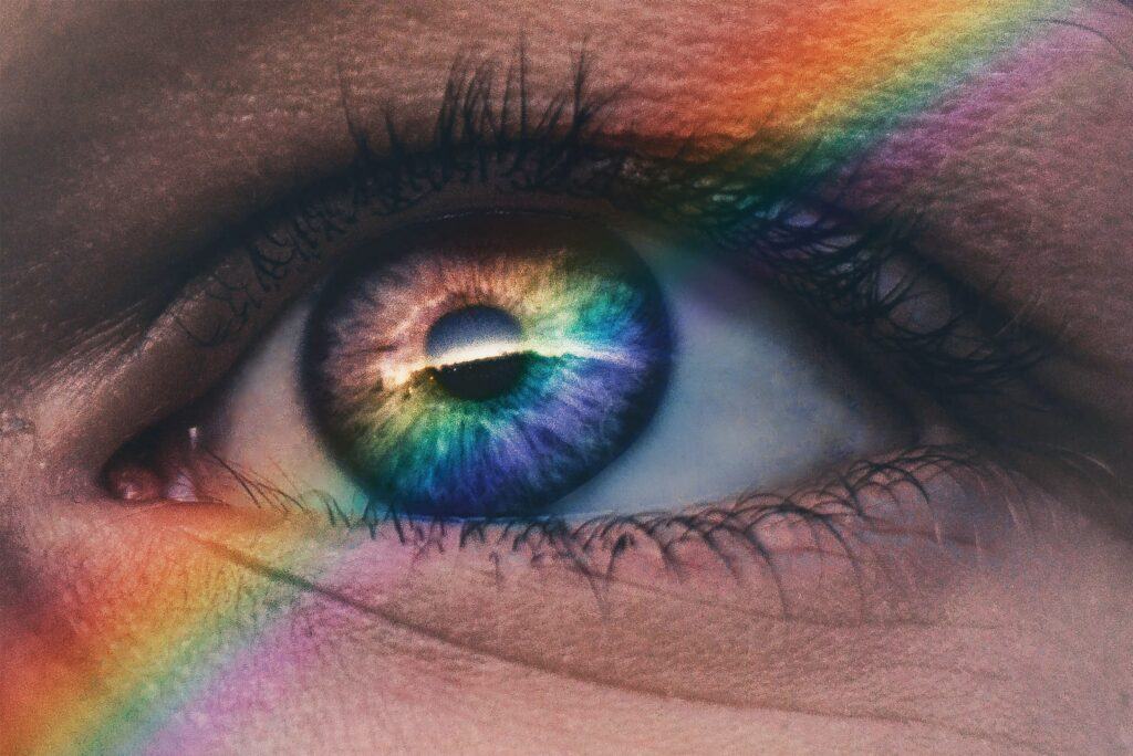 the human eye - the sense of sight - blue eye with rainbow light streaking across it
