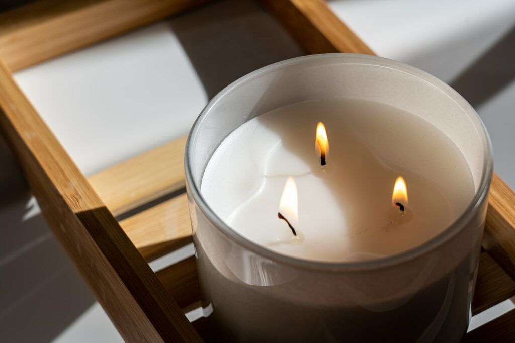 pampering your sense of sight - a candle flame flickers - photo by Castorly - Pexels