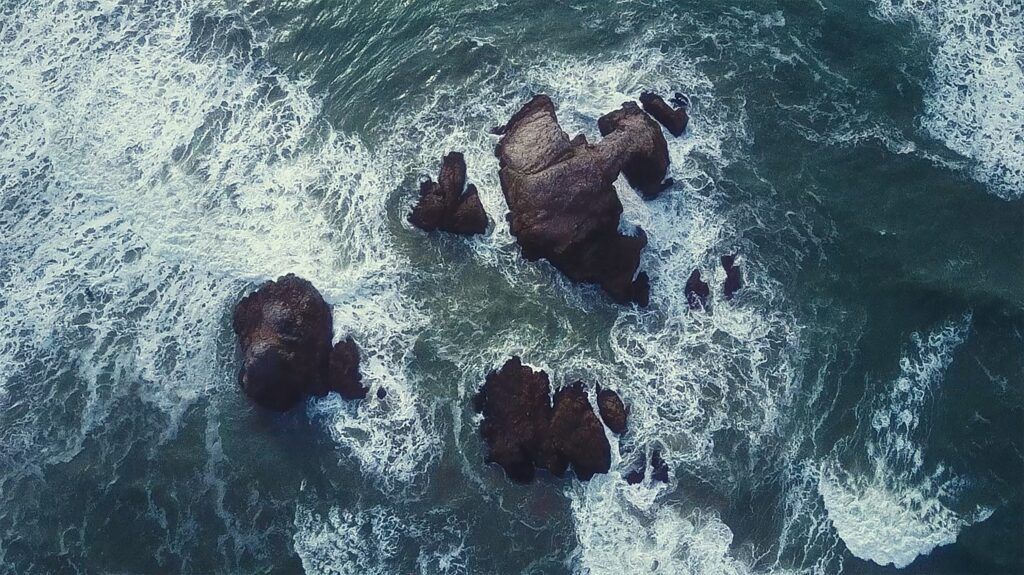 crashing waves arial view - a Highly Sensitive Person experiences life's turbulence more deeply