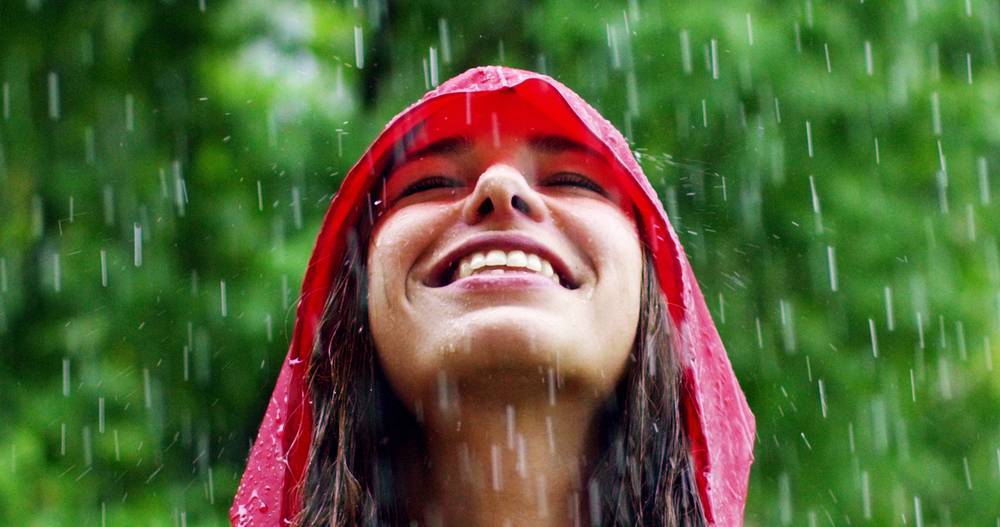 Mindful Living In All Kinds of Weather - Woman Smiling in the Rain