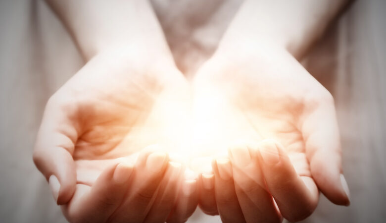 I Love Light - Hands Holding Light - Photo by NiseriN - iStock