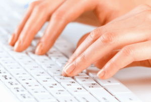 Online Resources for Bible Study - woman's hands on white keyboard