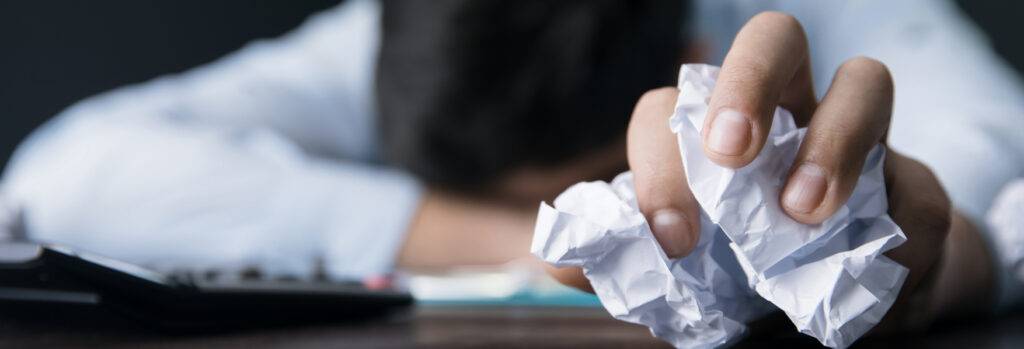 Ditch Perfectionism - Writing for Fun - Sad Man and Crumpled Paper in Hand