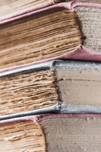 stack of old dusty books