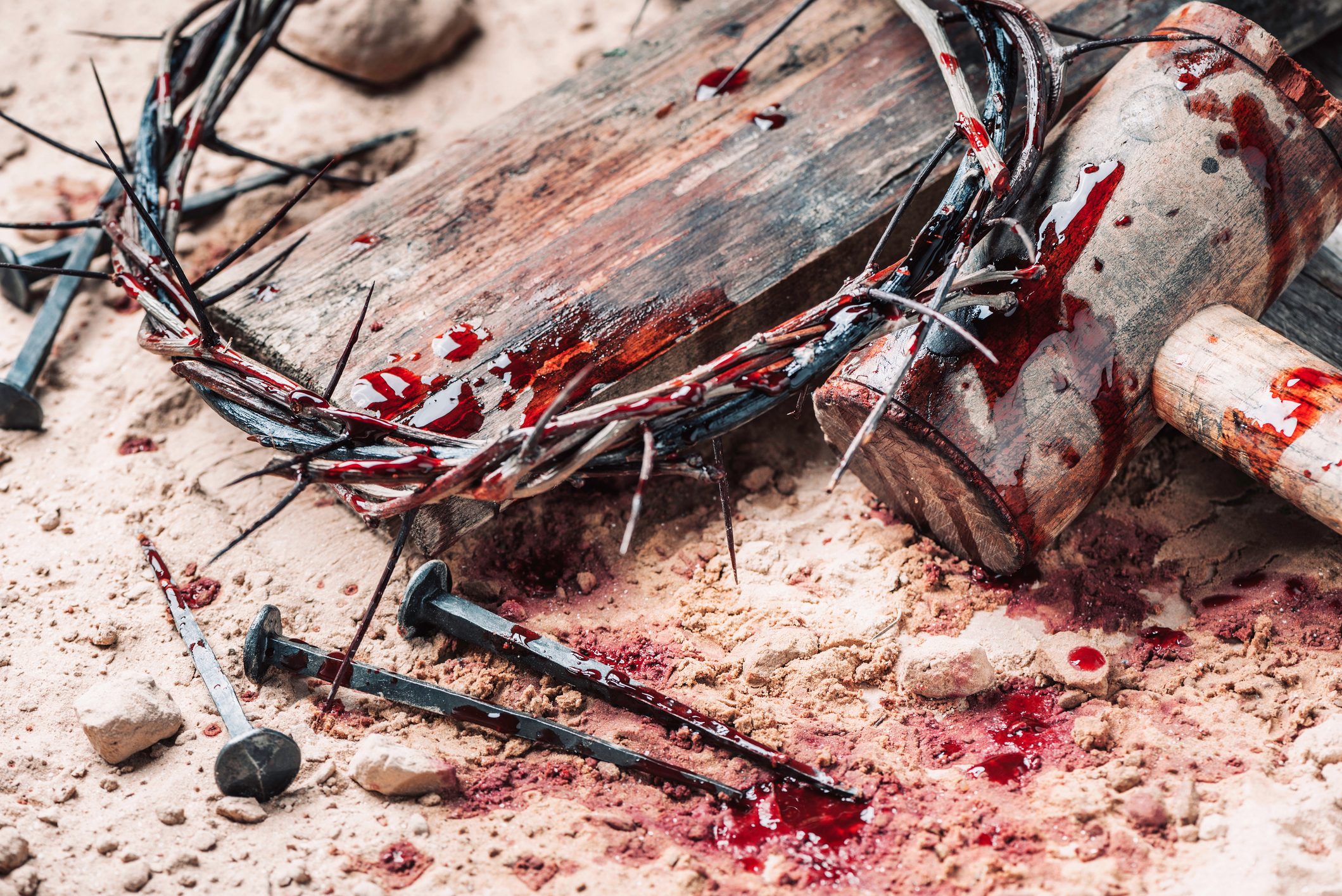 Bloody Crown and Stakes - Jesus Died for Your Sins - iStock 1290401675