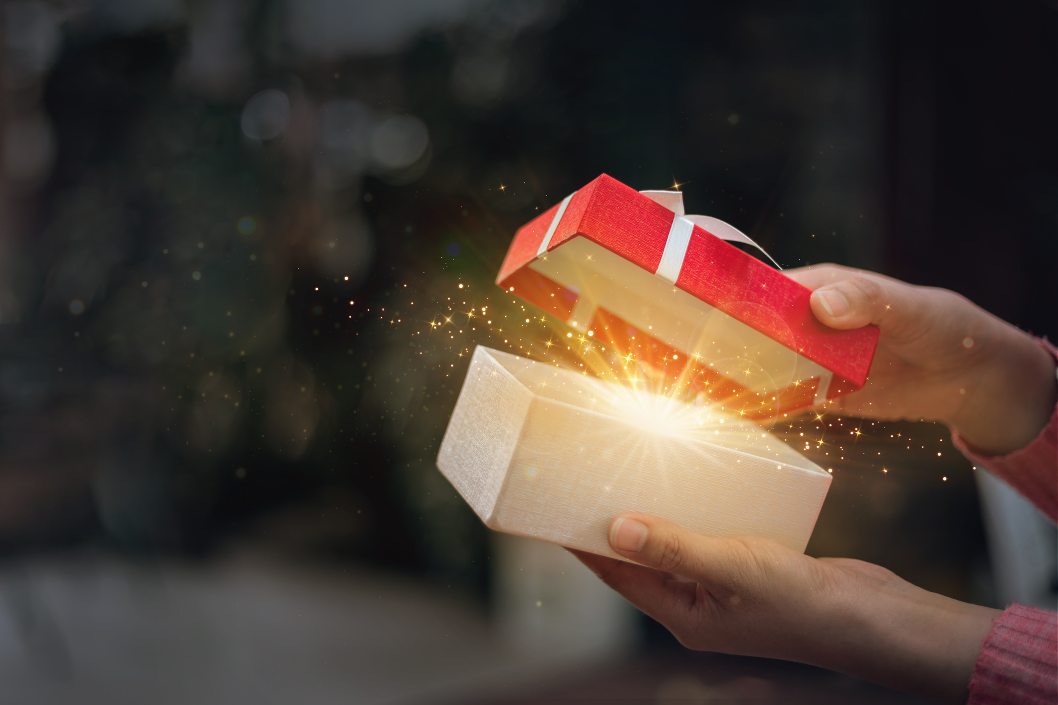 Hands Opening a Wondrous Gift