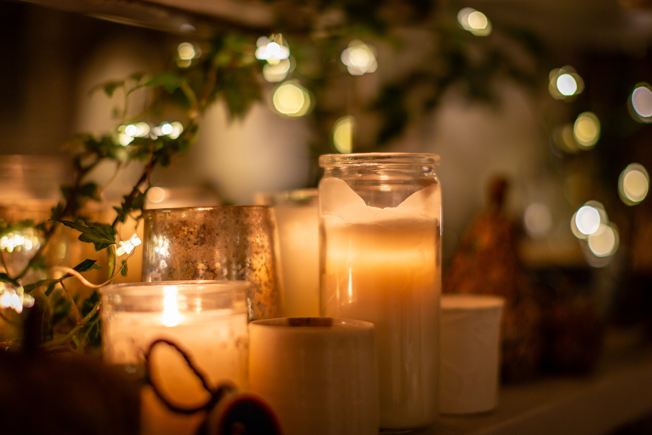 Bring Winter Light Indoors Burning Candles - iStock 1750845621